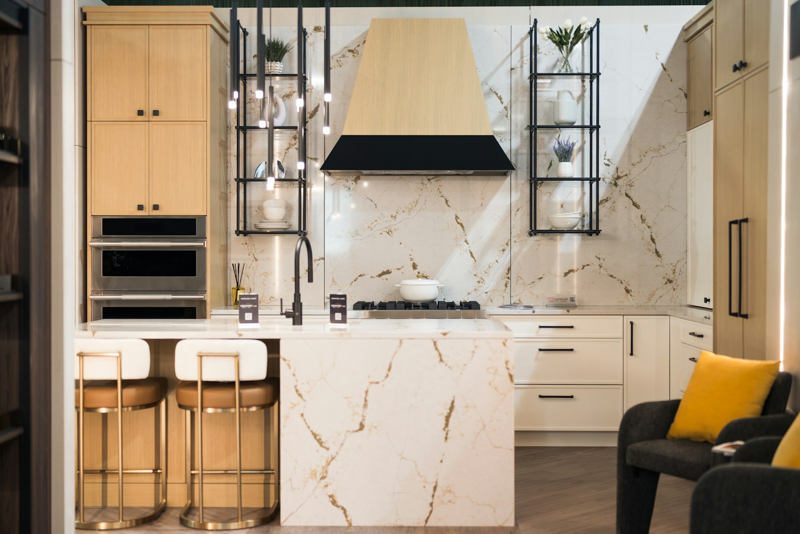 Finished custom kitchen with marble island and wood cabinetry